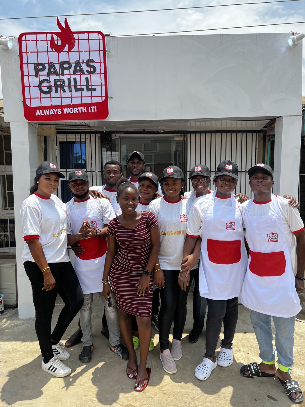 Papa's Grill team outside the store